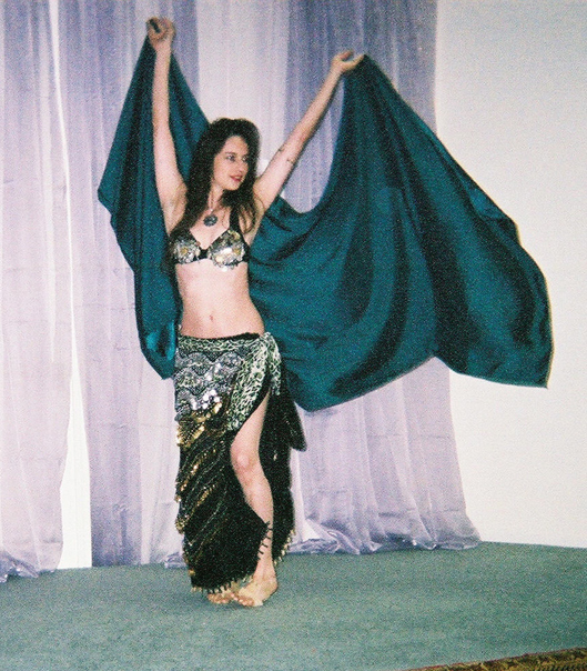 Jasmine in a green costume